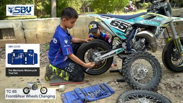 Vincent and Leon working together to change a motorcycle wheel with SBVTools.