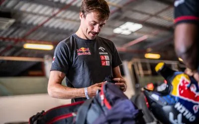 A mechanic preparing the rally car at the 2022 Abu Dhabi Desert Challenge