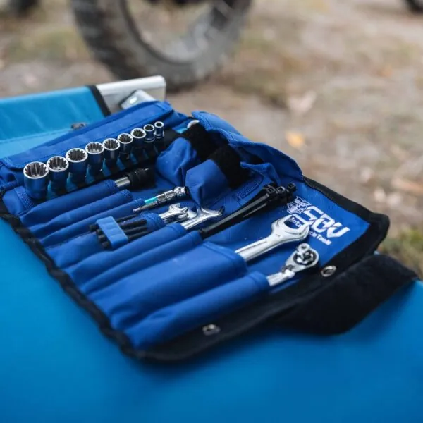 SBVTools motorcycle tool set beside a BMW motorcycle at the GS Trophy 2026 in Romania